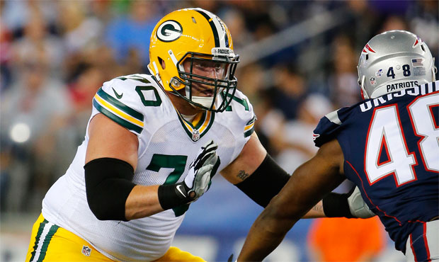 After visiting the Seahawks over the weekend, former Packers guard T.J. Lang, 29, signed a three-ye...