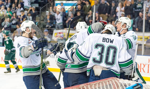 The T-Birds surround goalie Landon Bow to celebrate their series-clinching win over Everett. (T-Bir...