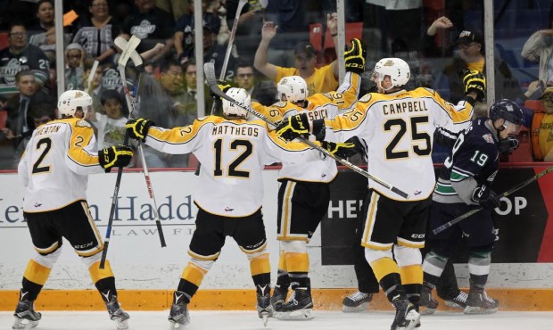 Brandon's Tanner Kaspick celebrates with his teammates after scoring the game-winner. (Photo by Tim...