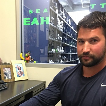 Seahawks athletic trainer Derin Lazuta shows the pen dropped in his mug by tight end Jimmy Graham. ...
