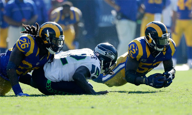 Seattle's final drive ended when Christine Michael fumbled at the Rams' 29-yard line with under a m...