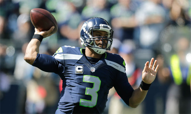 Russell Wilson's ankle injury could lead to more shotgun formations against the Rams, writes John C...