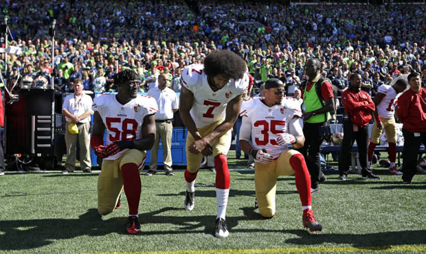 Eli Harold, Colin Kaepernick and Eric Reid of the 49ers all knelt during the national anthem Sunday...