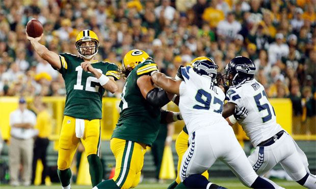 Aaron Rodgers says he's pulling for UW over Alabama and that he's a fan of WSU coach Mike Leach. (A...