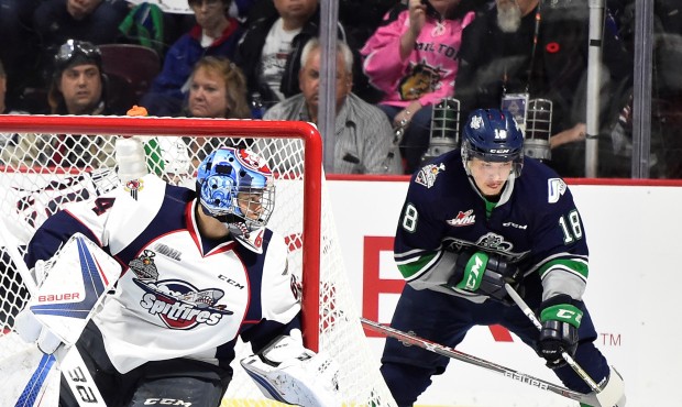 Sami Moilanen attempts a wrap around against Windsor's Michael DiPietro ( Photo by Aaron Bell/CHL I...