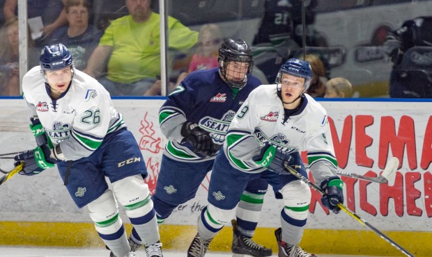 Nolan Volcan (left) and Elijah Brown move the puck during the T-Birds Blue-White game (Brian Liesse...