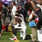 
              Tampa Bay Buccaneers wide receiver DeSean Jackson, center, takes a knee during the national anthem before an NFL football game against the Minnesota Vikings, Sunday, Sept. 24, 2017, in Minneapolis. (AP Photo/Jim Mone)
            