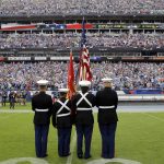 
              The American flag is presented in front of an empty Tennessee Titans bench area during the playing of the national anthem before an NFL football game between the Titans and the Seattle Seahawks Sunday, Sept. 24, 2017, in Nashville, Tenn. Neither team came onto the field for the anthem. (AP Photo/James Kenney)
            