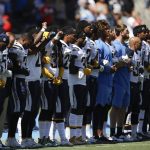 
              Members of the Los Angeles Chargers link arms during the national anthem before an NFL football game against the Kansas City Chiefs, Sunday, Sept. 24, 2017, in Carson, Calif. (AP Photo/Jae C. Hong)
            