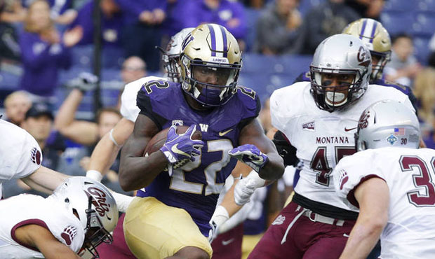 UW's O-line needs to create more room for their running backs, according to Brock Huard. (AP)...