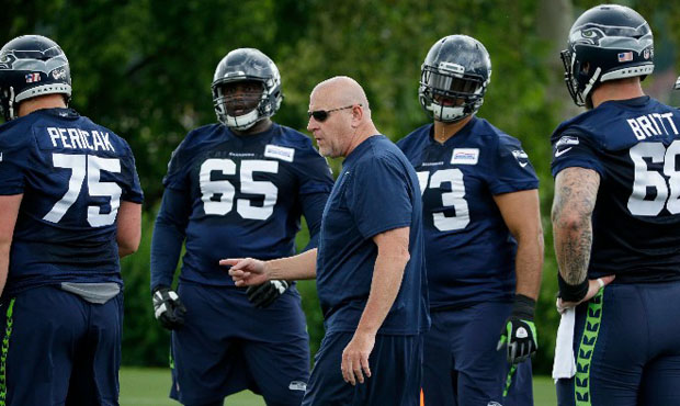 Jim Moore believes Tom Cable was made out to be a better O-line coach than he actually was. (AP)...