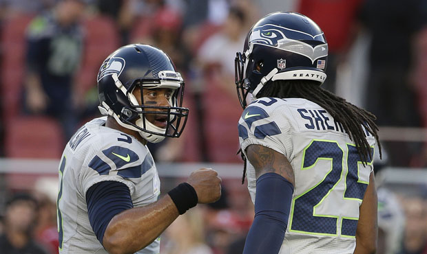 Russell Wilson will find himself throwing against Richard Sherman next season. (AP)...