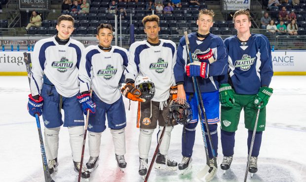 Mekai Sanders (center) poses with some of his fellow Washingtonians after a scrimmage at T-Birds tr...