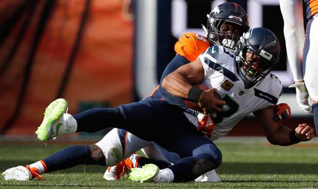 Seahawks' QB Russell Wilson was sacked six times Sunday. (AP)...