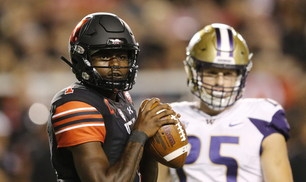 Utah QB Tyler Huntley was tricked into an interception by the UW Huskies. (AP)...