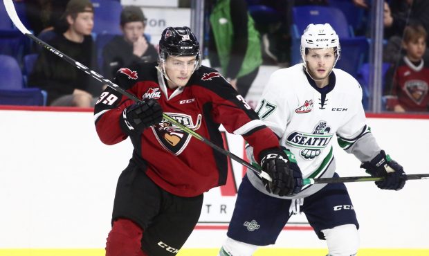Seattle's Jaxan Kaluski fights for position with Vancouver's Evan Patrician Saturday night (Rik Fed...