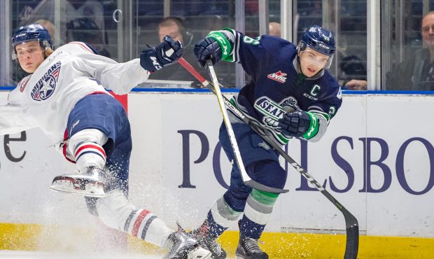 Seattle captain Nolan Volcan muscles his way past a Tri-City defender during the T-Birds overtime l...