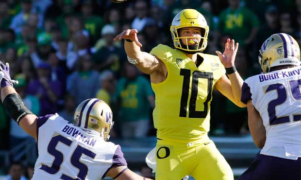 Oregon's Justin Herbert threw for 202 yards and 2 touchdowns against the Huskies. (AP)...
