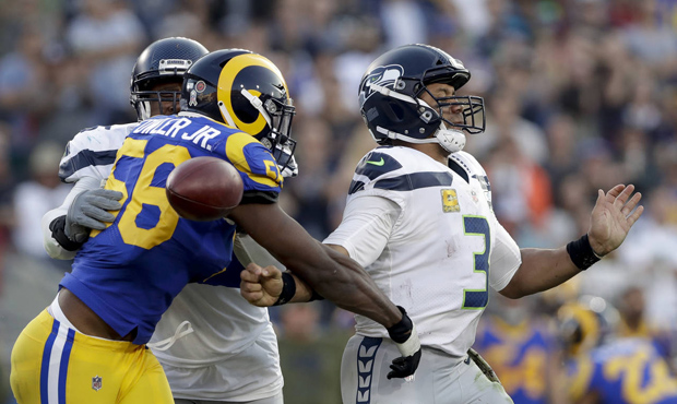 Russell Wilson's fumble was a back-breaking turnover in the Seahawks' loss to the Rams. (AP)...