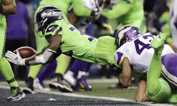 Chris Carson scored the first of two Seahawks touchdowns in the fourth quarter. (AP)...