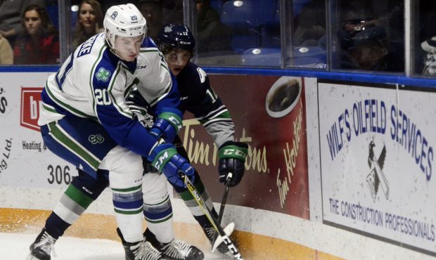 Seattle's Henrik Rybinski battles Swift Current's Ethan O'Rourke for the puck during the Thunderbir...