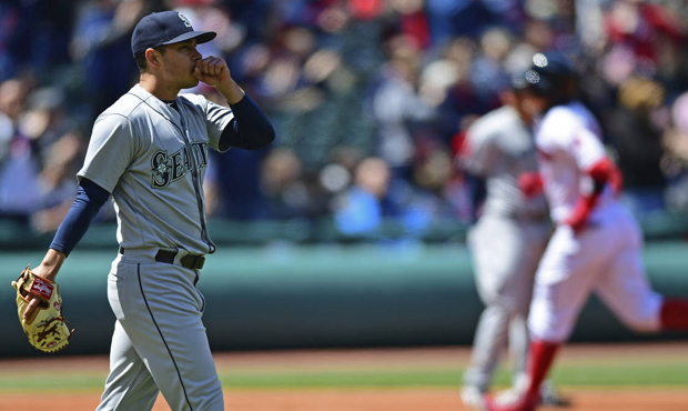 Seattle Mariners starting pitcher Marco Gonzales waits for Cleveland Indians' Brandon Guyer to run ...