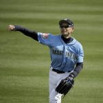 
              Seattle Mariners right fielder Ichiro Suzuki warms up in the outfield before the second inning of a spring training baseball game against the Oakland Athletics, Friday, Feb. 22, 2019, in Peoria, Ariz. (AP Photo/Charlie Riedel)
            