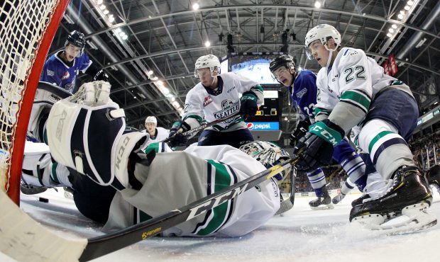 Thunderbirds goalie Roddy Ross tries to cover a loose puck during Seattle's 3-1 loss Saturday night...