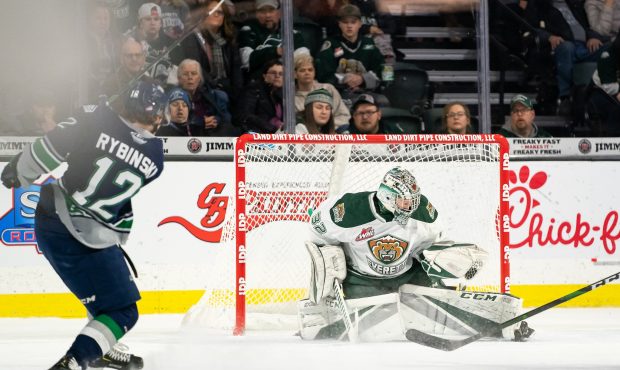 Everett Silvertips goalie Dustin Wolf stops Thunderbirds center Henrik Rybinski Saturday night. (Ch...