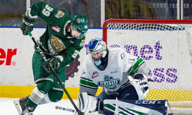 Thunderbirds goalie Roddy Ross stops Everett's Gage Convalves during Sunday's game at the accesso S...