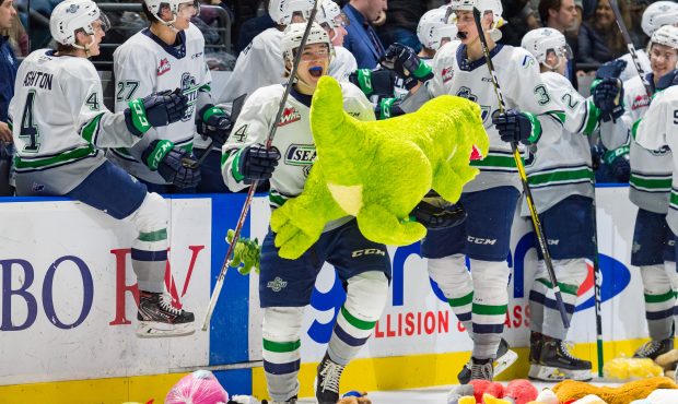 Seattle's Conner Roulette celebrates, while avoiding stuffed animals, scoring the 'Teddy Bear' goal...