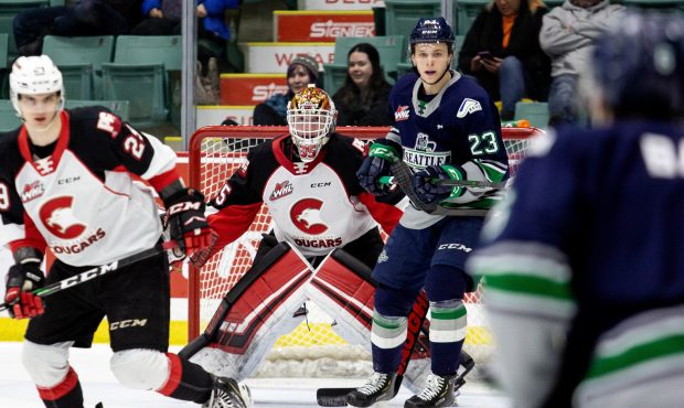 Seattle's Brendan Williamson tries to screen Prince George goalie Taylor Gauthier. (Brett Cullen/Co...