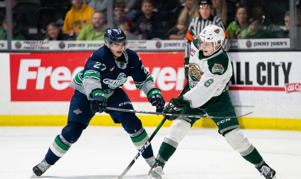 Thunderbirds defenseman Ryan Gottfried battles for the puck during the Thunderbirds win in Everett....