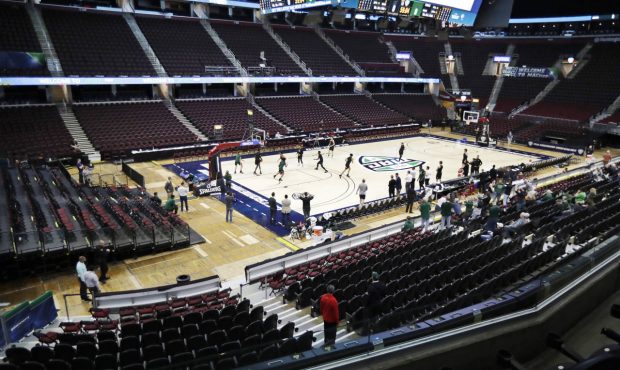 sports world halts, MAC tournament...