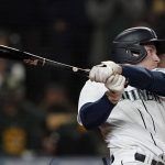 
              Seattle Mariners' Jarred Kelenic follows through on a two-RBI double against the Oakland Athletics during the sixth inning of a baseball game, Wednesday, Sept. 29, 2021, in Seattle. Mitch Haniger and Ty France scored on the play. (AP Photo/Ted S. Warren)
            