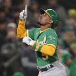 
              Oakland Athletics' Tony Kemp reacts as he crosses the plate after hitting a solo home run during the sixth inning of a baseball game against the Seattle Mariners, Wednesday, Sept. 29, 2021, in Seattle. (AP Photo/Ted S. Warren)
            