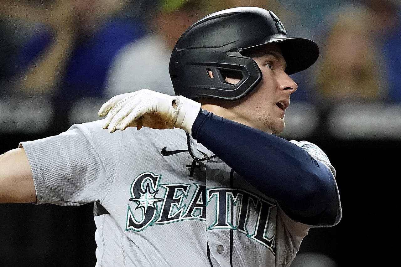Seattle Mariners' Jarred Kelenic watches his two-run home run during the fourth inning of a basebal...