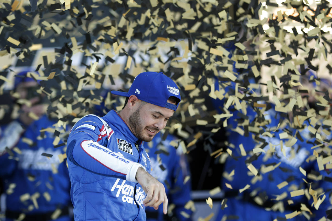 Kyle Larson reacts in Victory Lane after winning a NASCAR Cup Series auto race at Kansas Speedway i...