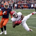 
              Rutgers wide receiver Bo Melton, right, catches a pass from quarterback Noah Vedral as Illinois defensive back Tony Adams defends during the first half of an NCAA college football game Saturday, Oct. 30, 2021, in Champaign, Ill. (AP Photo/Charles Rex Arbogast
            