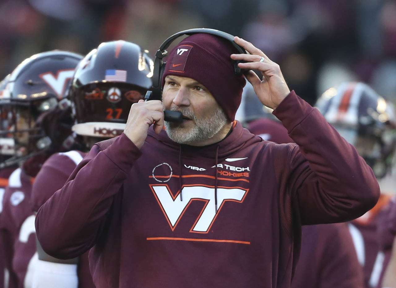 Virginia Tech head coach Justin Fuente is shown during a timeout in an NCAA college football game a...