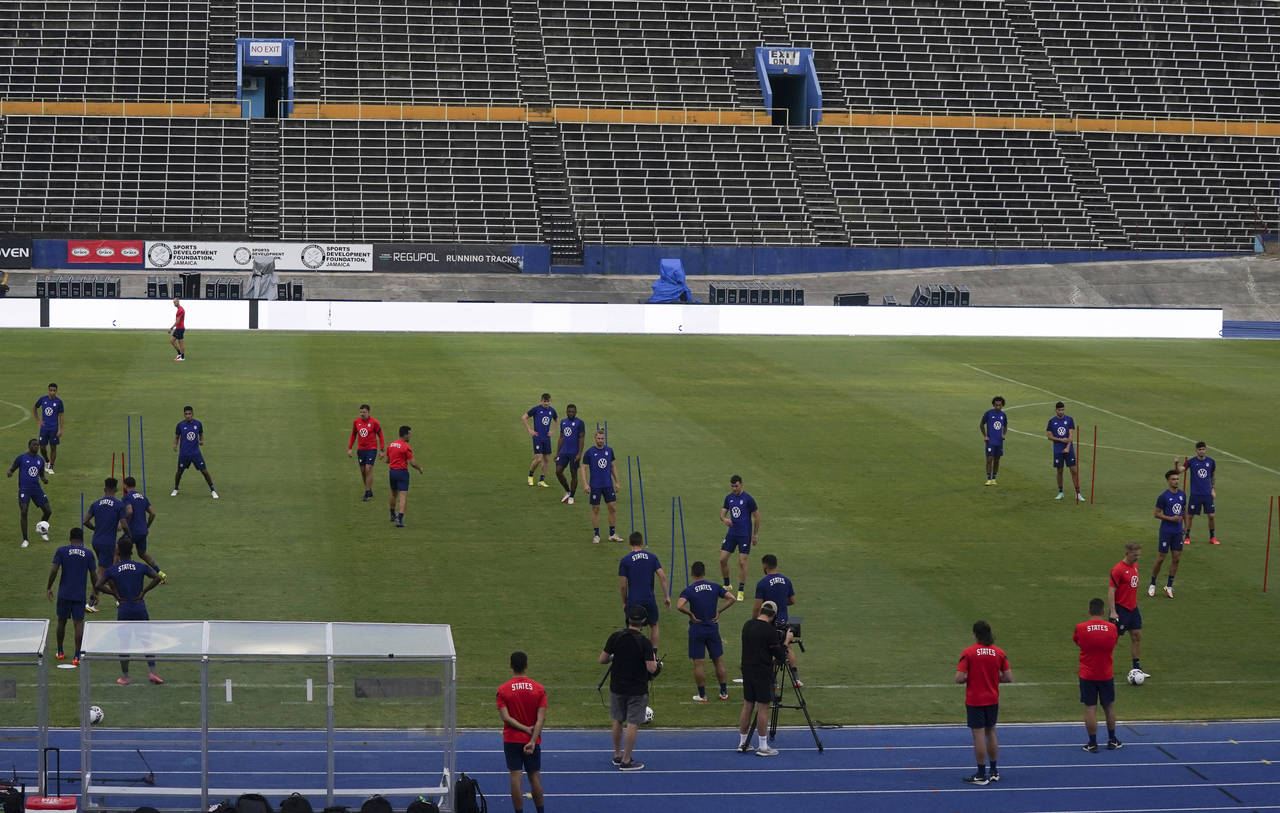 United States' players warm up during a training session ahead of the World Cup 2022 qualifying soc...