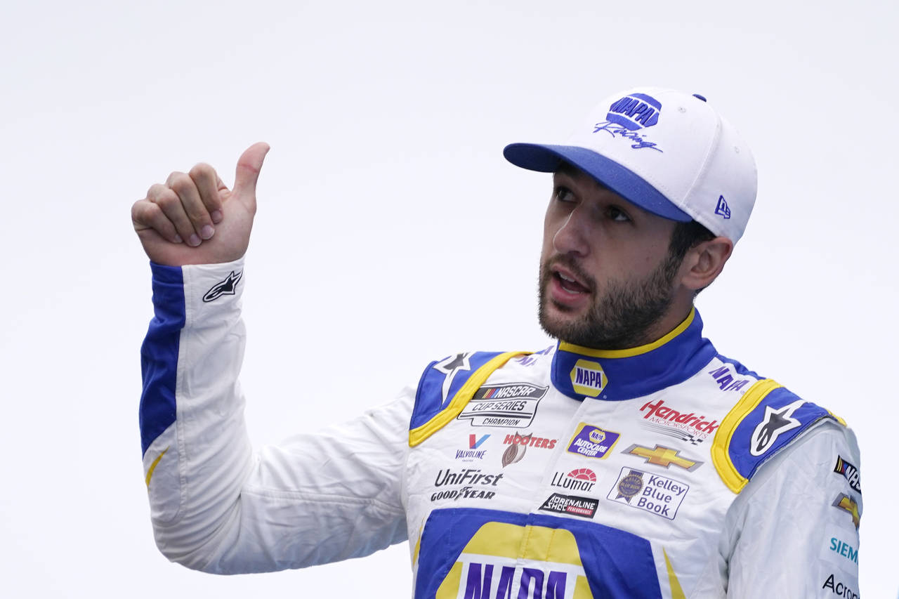 FILE - Chase Elliott gestures at a NASCAR Cup Series auto race, Sunday, July 18, 2021, in Loudon, N...