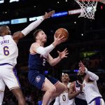 Claxton oops over James late, Nets hold off Lakers 122-115