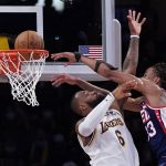 Claxton oops over James late, Nets hold off Lakers 122-115