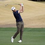 Cantlay fights through gusting wind, leads American Express