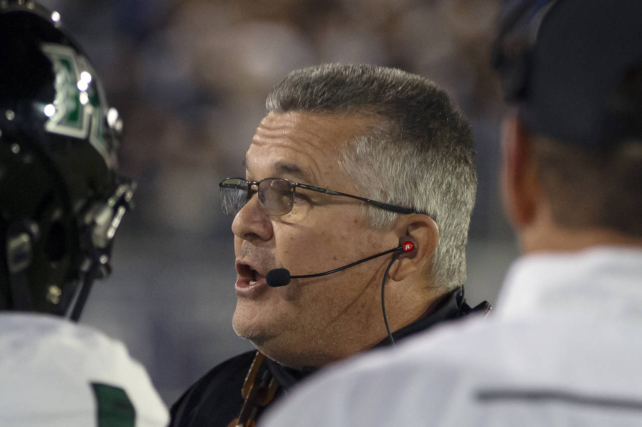 FILE -Hawaii head coach Todd Graham talks to his team on the sidelines against Nevada in the first ...