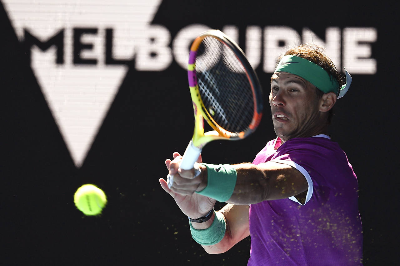 Rafael Nadal of Spain plays a forehand return to Yannick Hanfmann of Germany during their second ro...