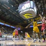 
              Arizona guard Kerr Kriisa (25) shoots a three-point basket over California guard Joel Brown (1) during the second half of an NCAA college basketball game in Berkeley, Calif., Sunday, Jan. 23, 2022. (AP Photo/Tony Avelar)
            