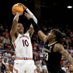 
              Auburn forward Jabari Smith (10) shoots a 3-pointer over Vanderbilt guard Jamaine Mann (23) during the second half of an NCAA college basketball game Wednesday, Feb. 16, 2022, in Auburn, Ala. (AP Photo/Butch Dill)
            