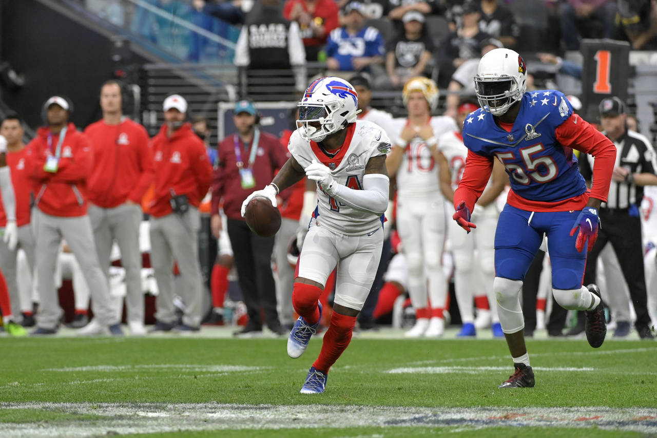 AFC wide receiver Stefon Diggs (14), of the Buffalo Bills, runs with the ball as NFC outside lineba...